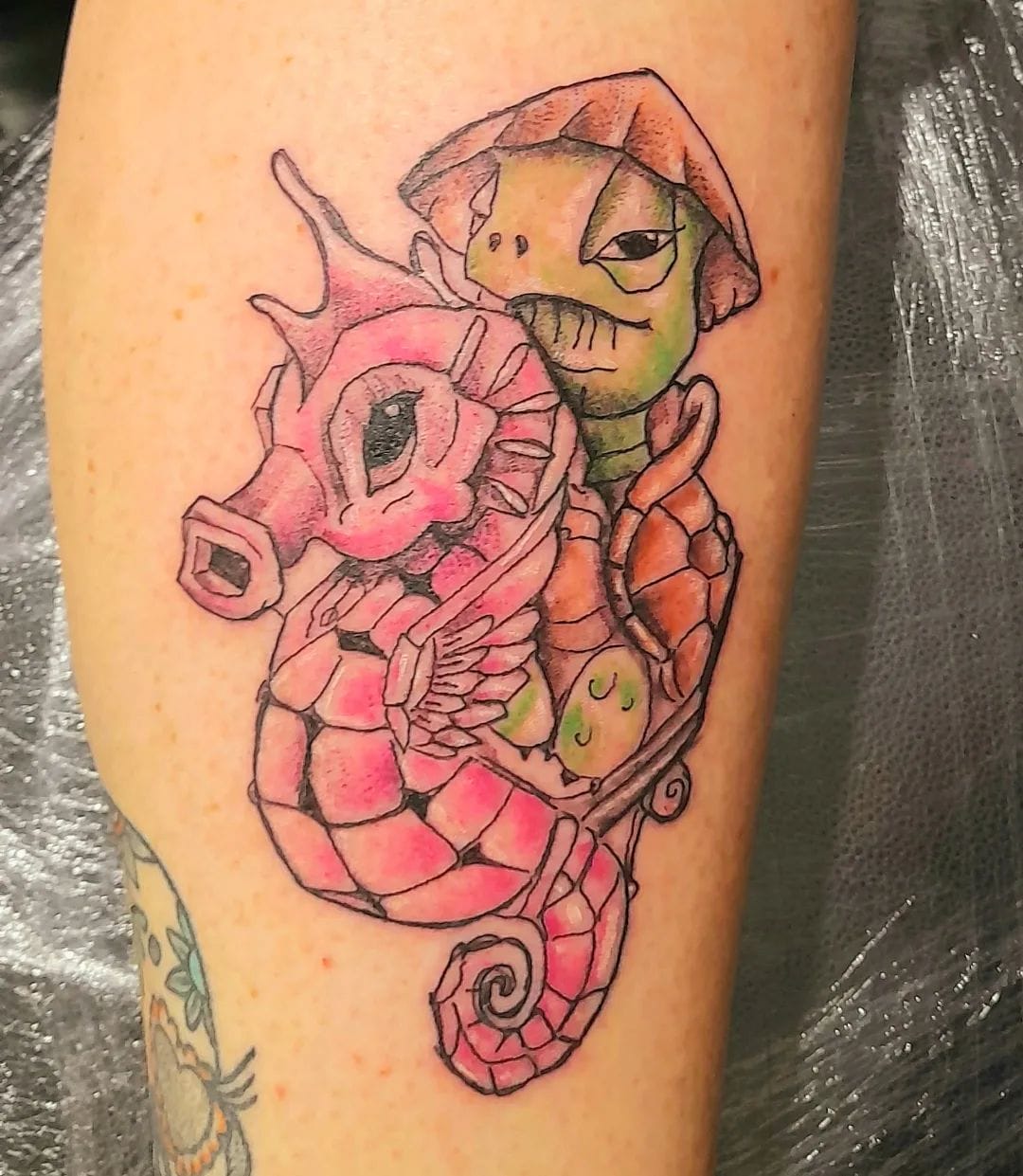 New-school colorful sea turtle and seahorse tattoo on the leg