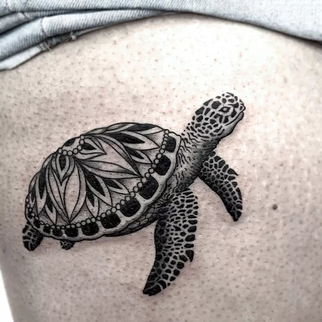 Mandala shell sea turtle tattoo on the thigh in black and grey