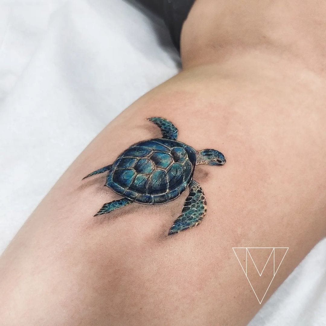 Hyperrealistic teal 3D sea turtle tattoo on the inner arm