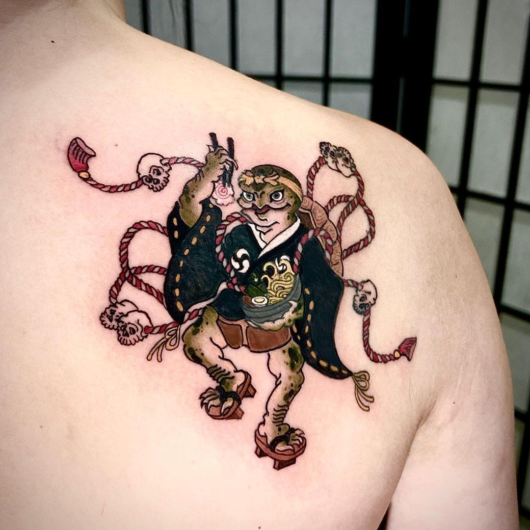 Japanese samurai turtle tattoo with ramen bowl and rope on the shoulder blade