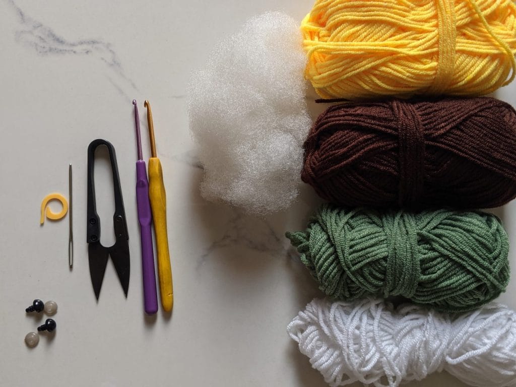 Sunflower turtle materials — milk cotton yarn in dark brown, light green, yellow, black and white, plus 8mm safety eyes and both 3.0mm and 3.5mm hooks