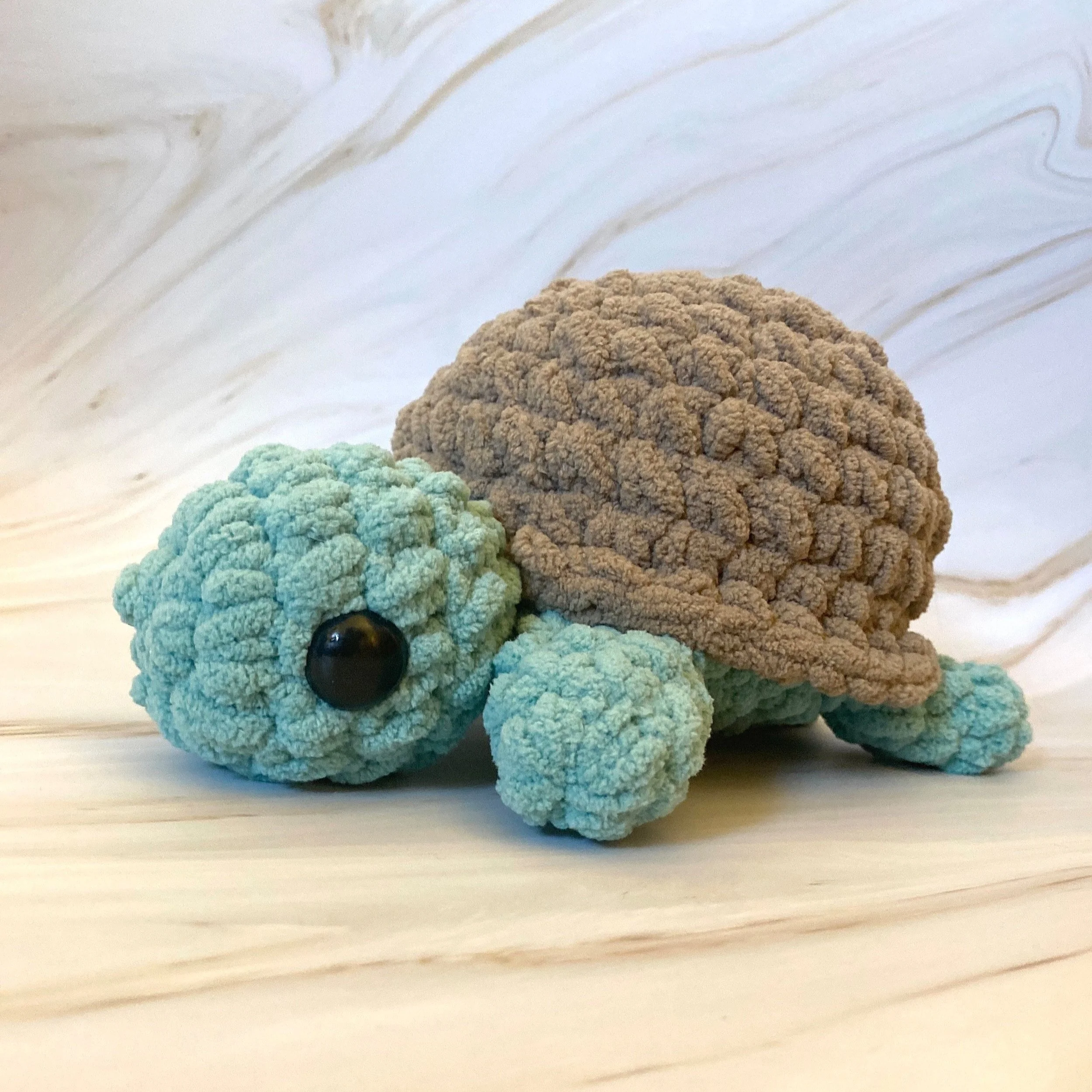 Brown and teal chunky crochet turtle, a quick one-hour beginner crochet pattern