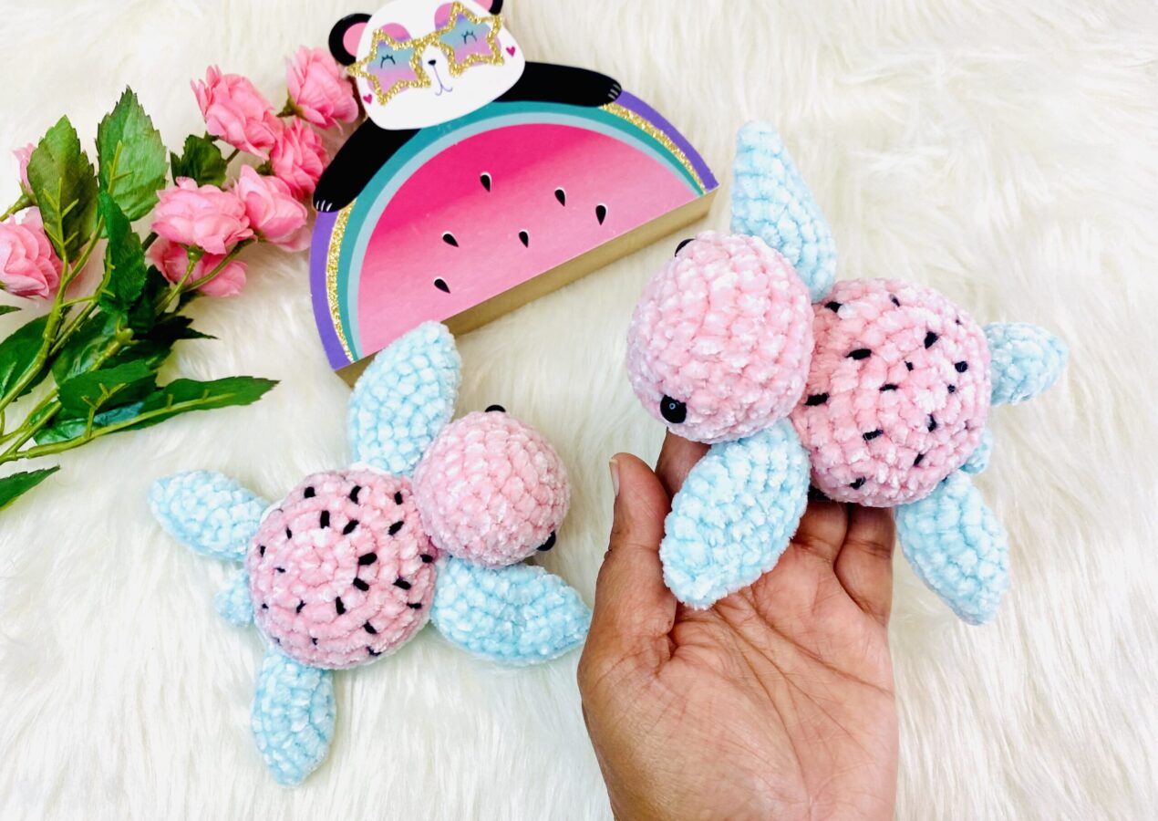 Pink and blue velvet kawaii watermelon crochet turtles held in a hand
