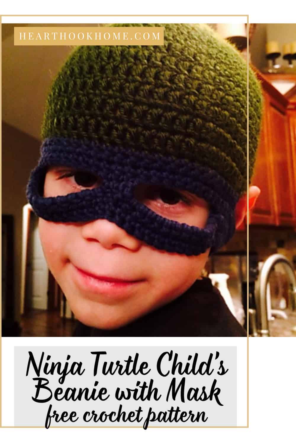 Child wearing a green crochet ninja turtle beanie with a pull-down eye mask