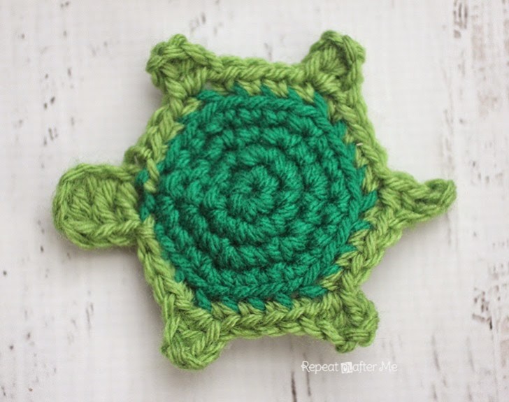 Flat green crochet turtle applique that can be turned into a ninja turtle